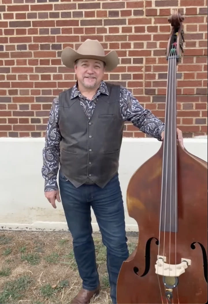Edgar Loudermilk holding his upright bass with a Chester microphone mounted